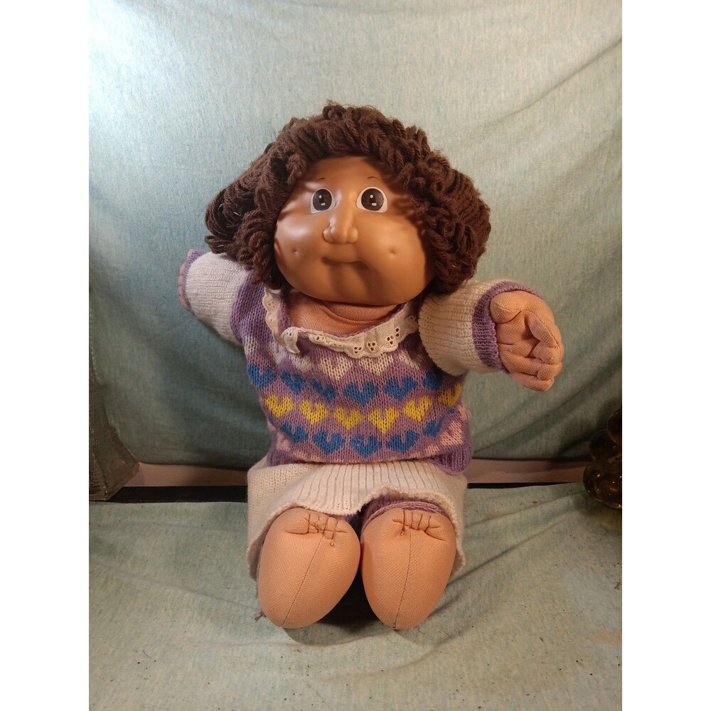 Vintage Cabbage Patch Kid Doll with Brown Curly Hair and Purple Sweater